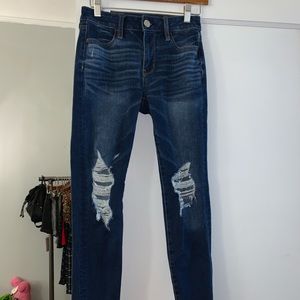 High waisted jeans with holes at the knee